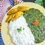 Close up of the Cassava Leaf Stew with white rice and fried plantain.