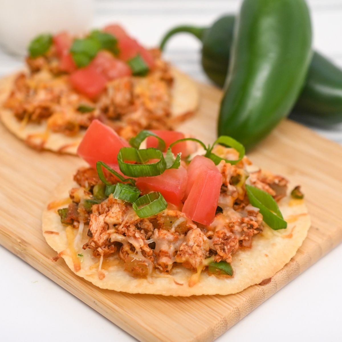 Keto Chicken Tostadas with green onions and tomatoes &ndash; a low-carb delight!