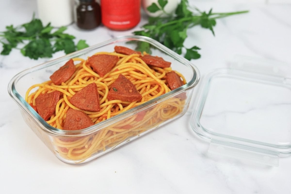Dominican Spaghetti with Salami in an airtight container
