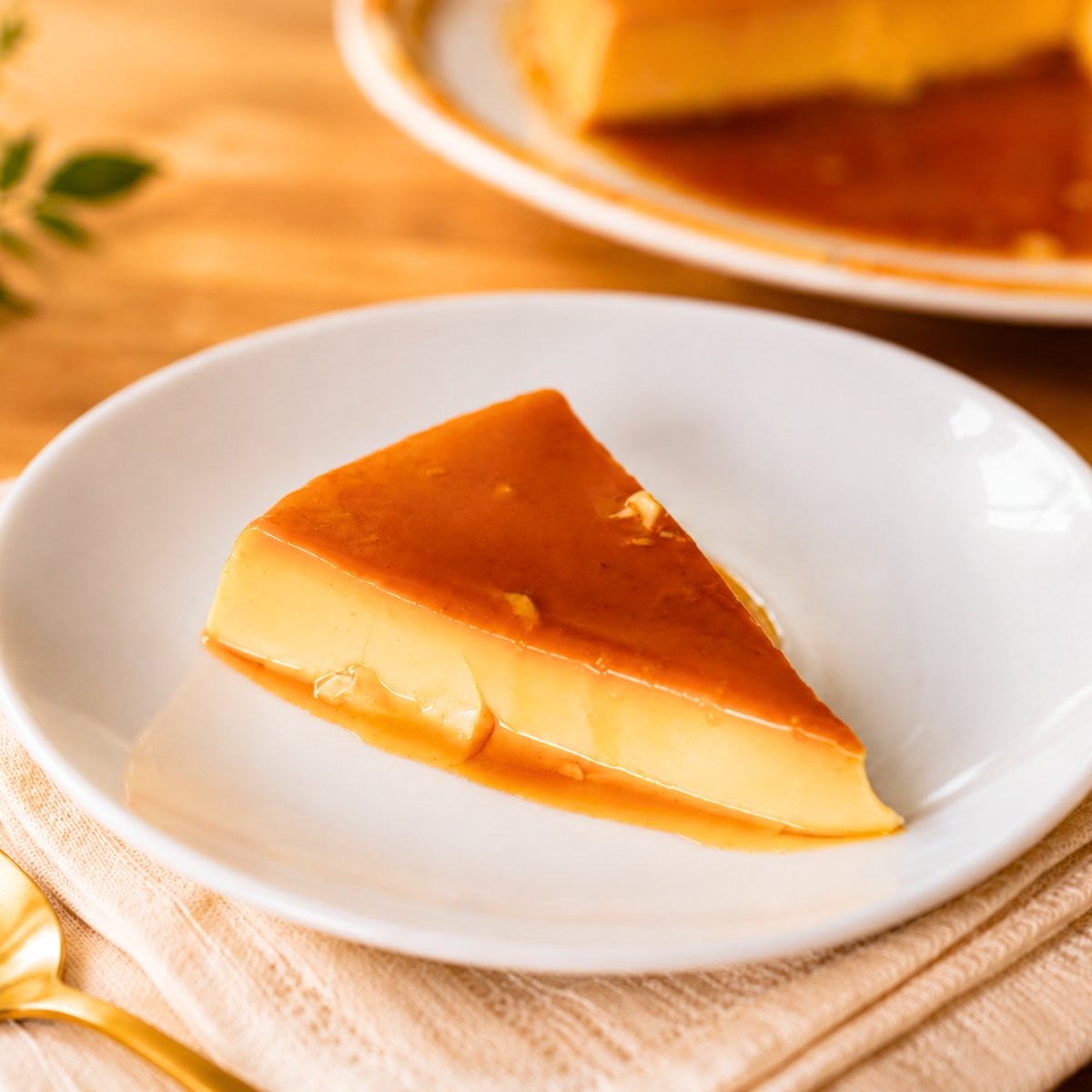 Creamy Venezuelan quesillo slice with golden caramel sauce