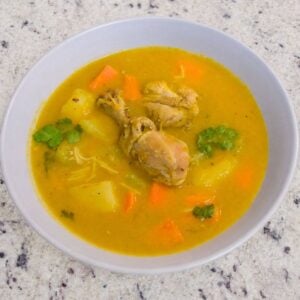 Dominican chicken soup with vegetables and potatoes