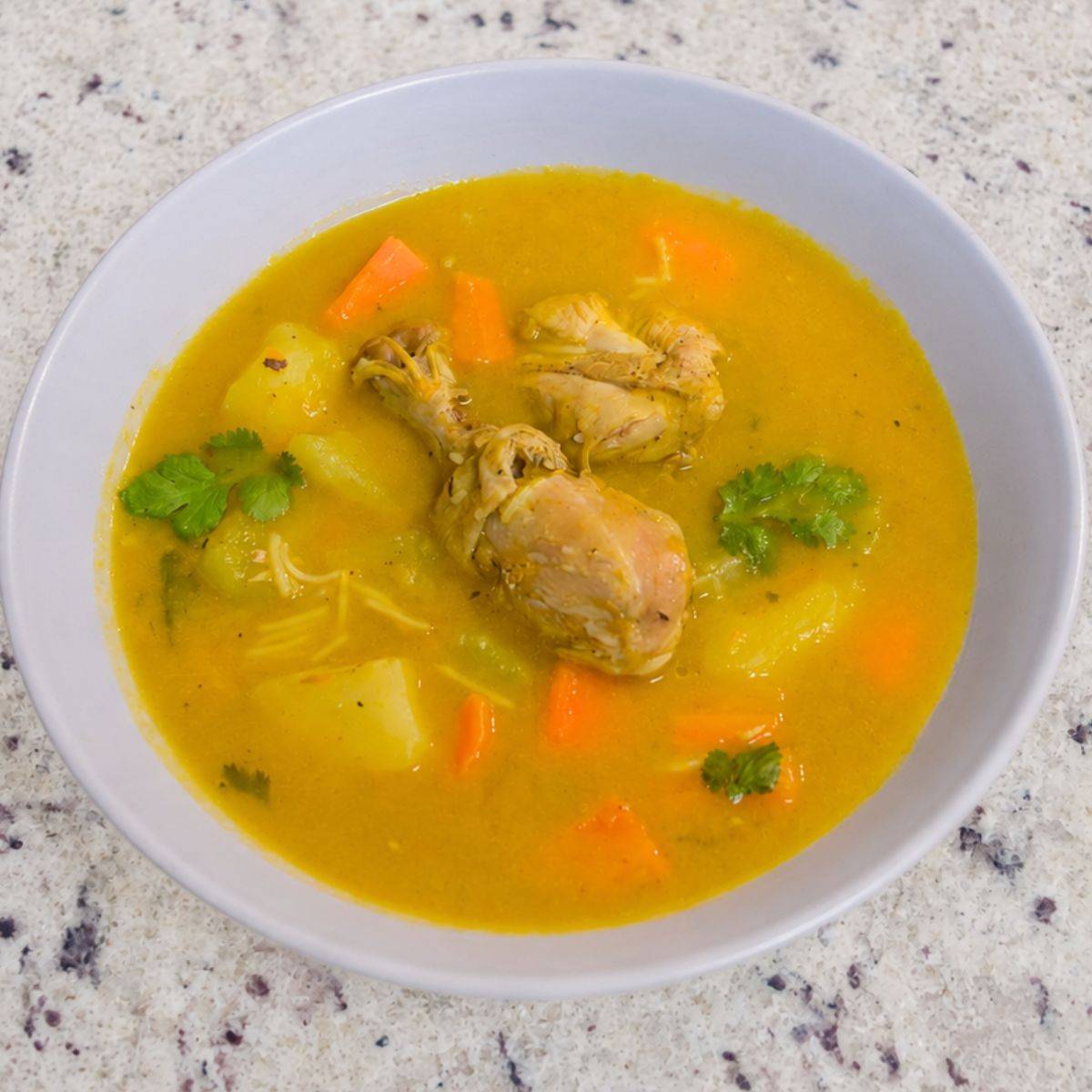 Dominican chicken soup with vegetables and potatoes