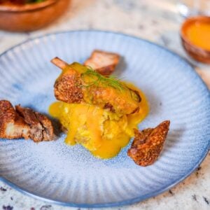 Dominican mofongo con chicharrón topped with creamy auyama sauce