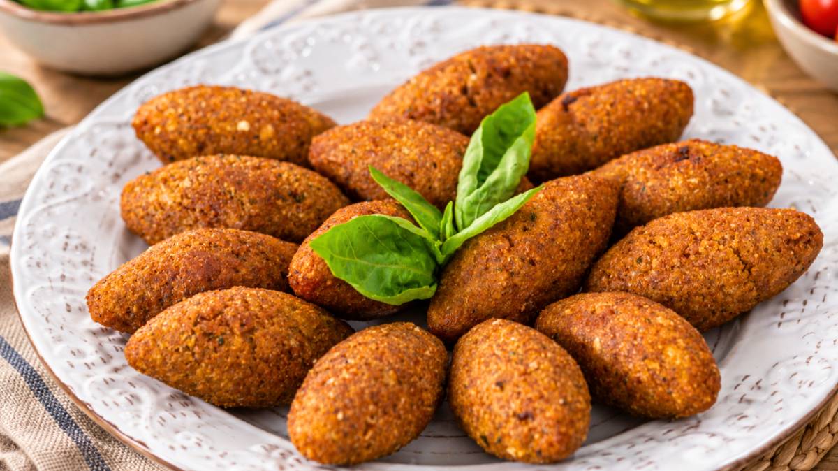Dominican quipes filled with seasoned meat served on a plate