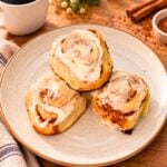 Homemade cinnamon rolls topped with cream cheese frosting