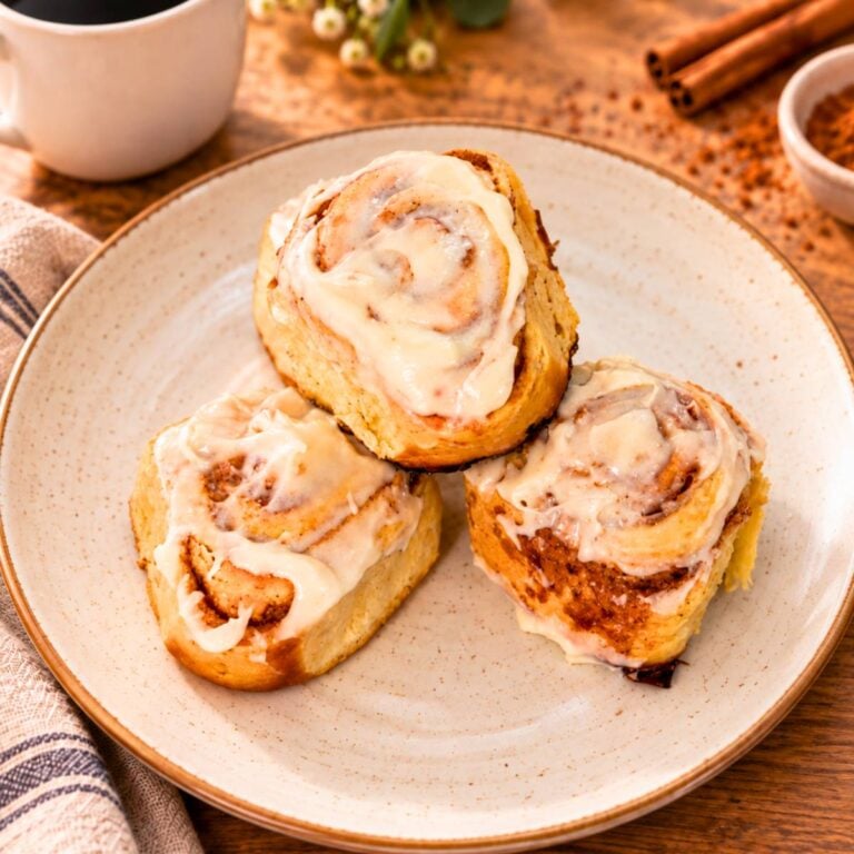 Homemade cinnamon rolls topped with cream cheese frosting