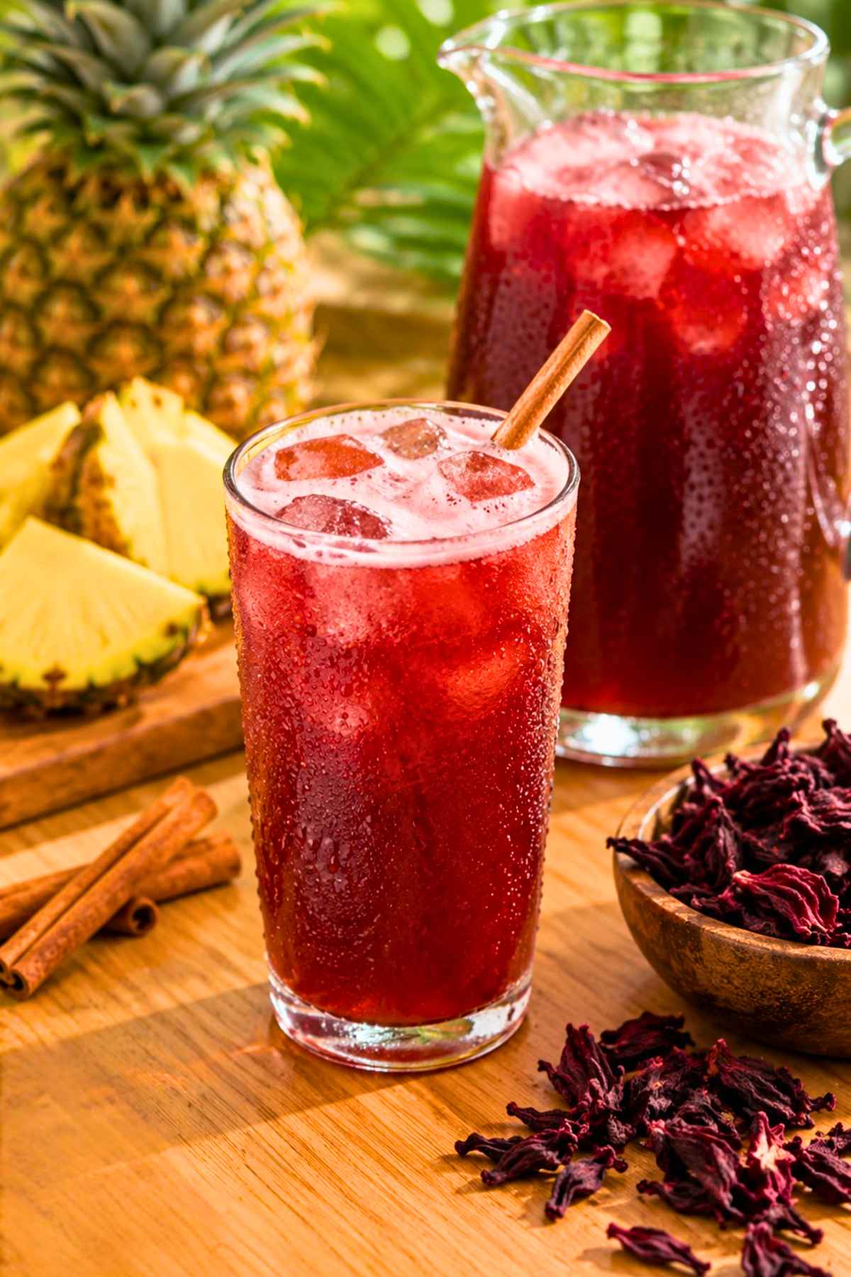 Refreshing red pineapple hibiscus juice in a drinking glass